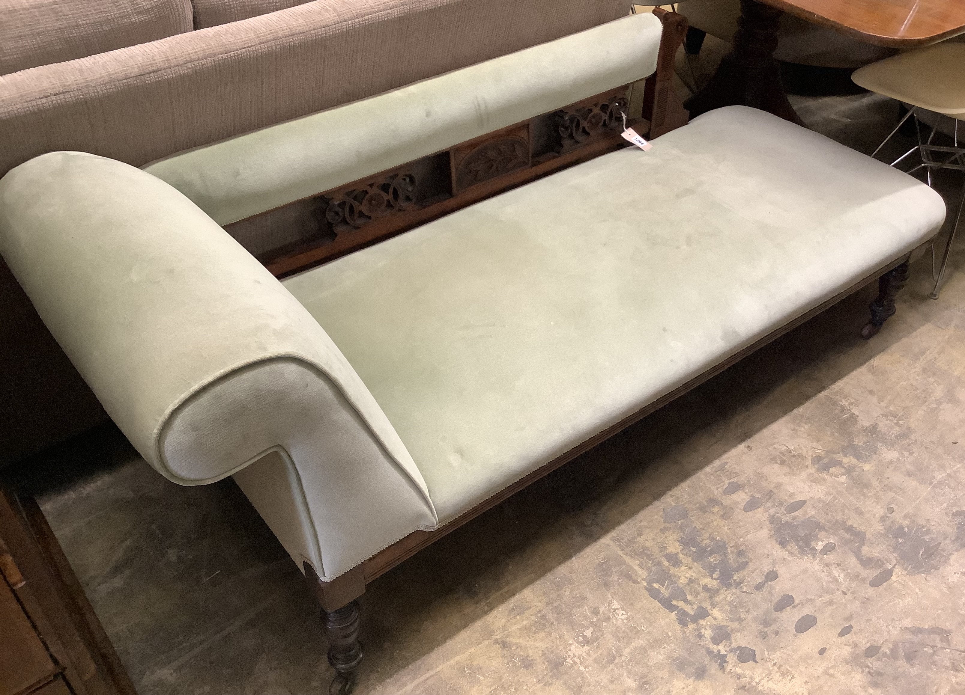 A late Victorian carved mahogany chaise longue, length 160cm, depth 60cm, height 72cm